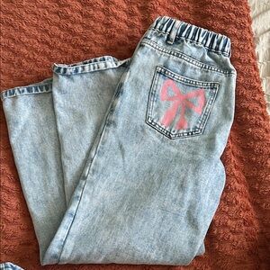 SHEIN Light Blue Jeans with Pink Bow Accent